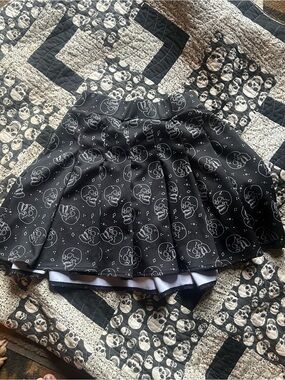 Spencer's Black Circle Skater Skirt with White Skull Print